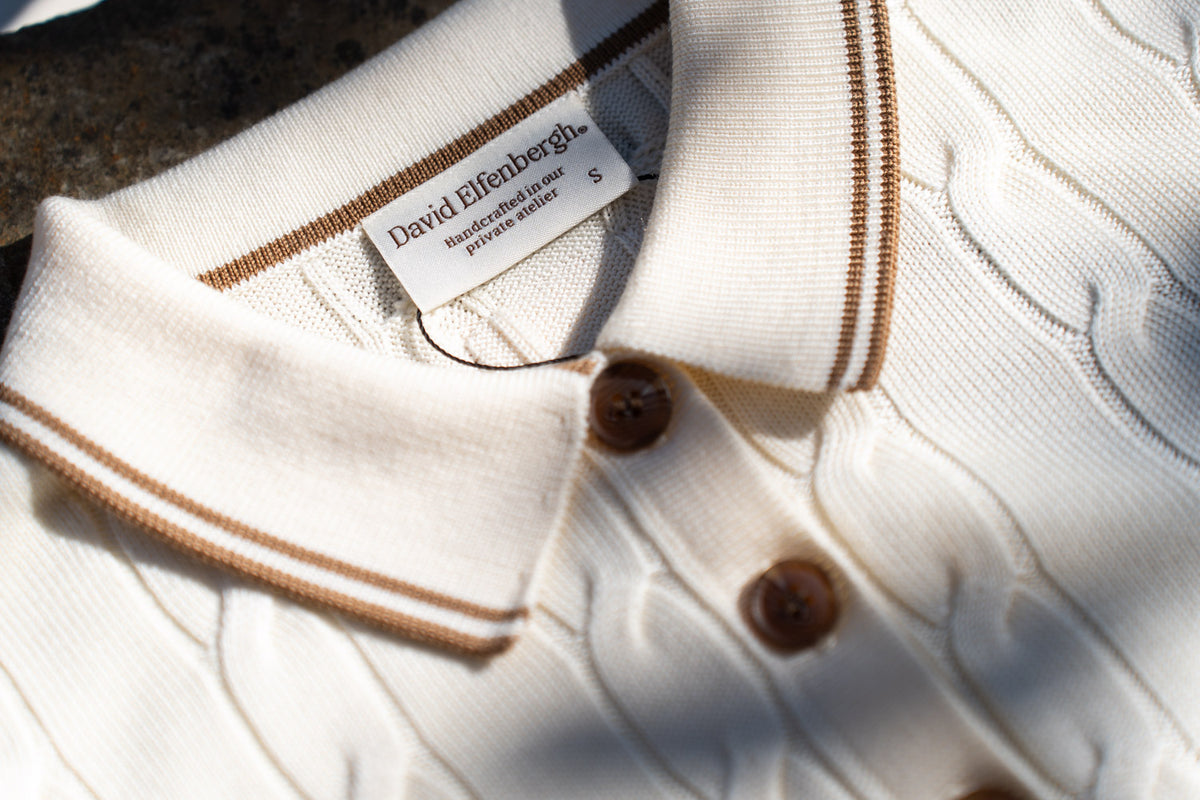 Aurus cable knit polo Elfenbergh handcrafted badge men